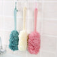 brosse exfoliante a long manche couleurs sous douche