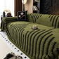 couvetures de sofa vert dans un salon