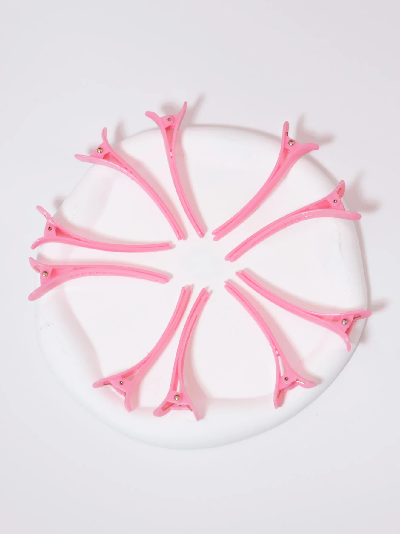 pince a cheveux rose en cercle