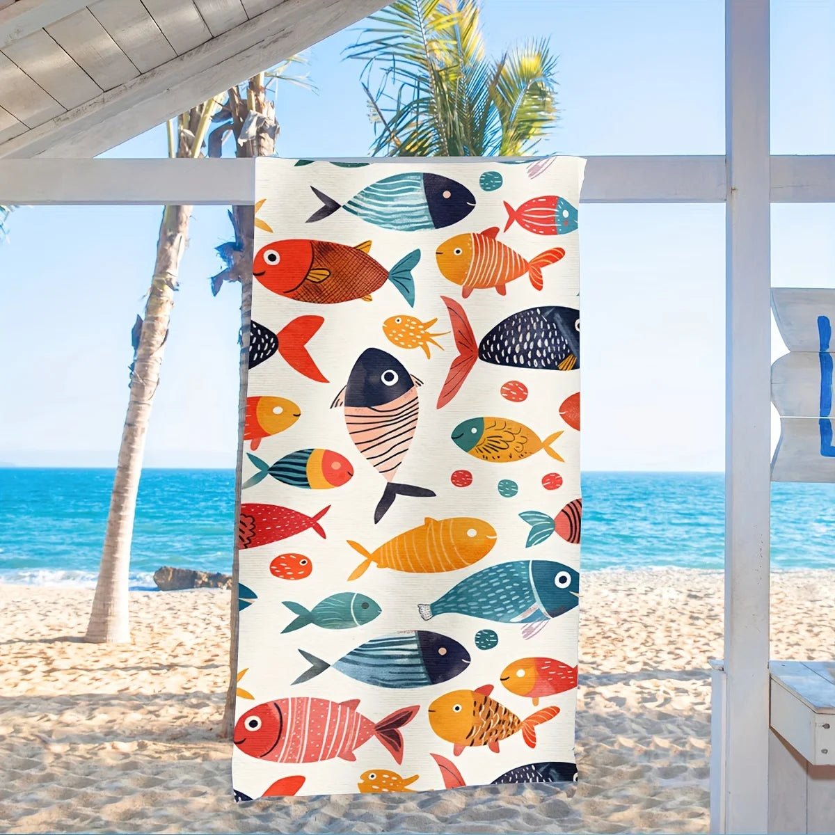 Serviette de poissons accrochee cabane blanche
