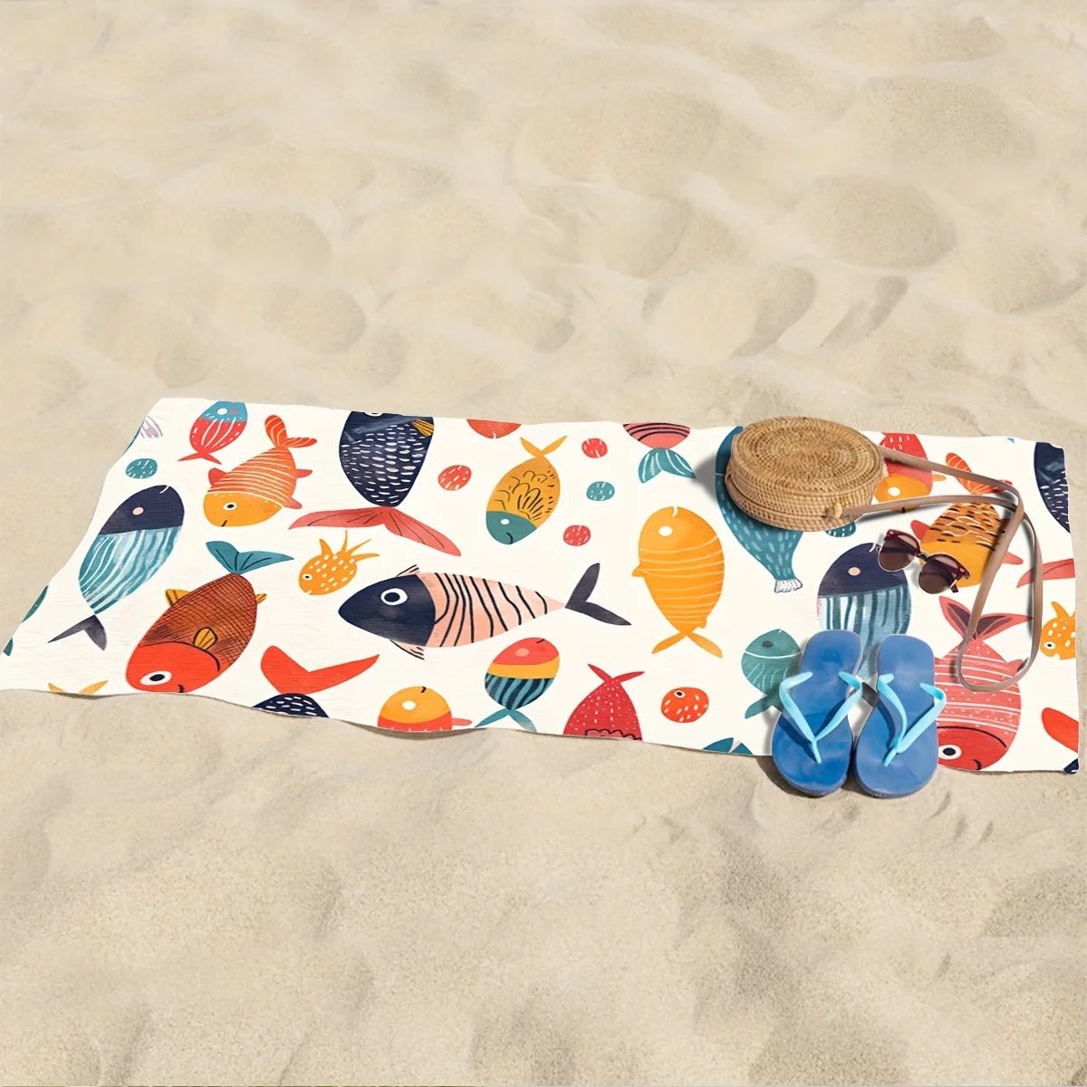 serviette de poissons etalee sur sable