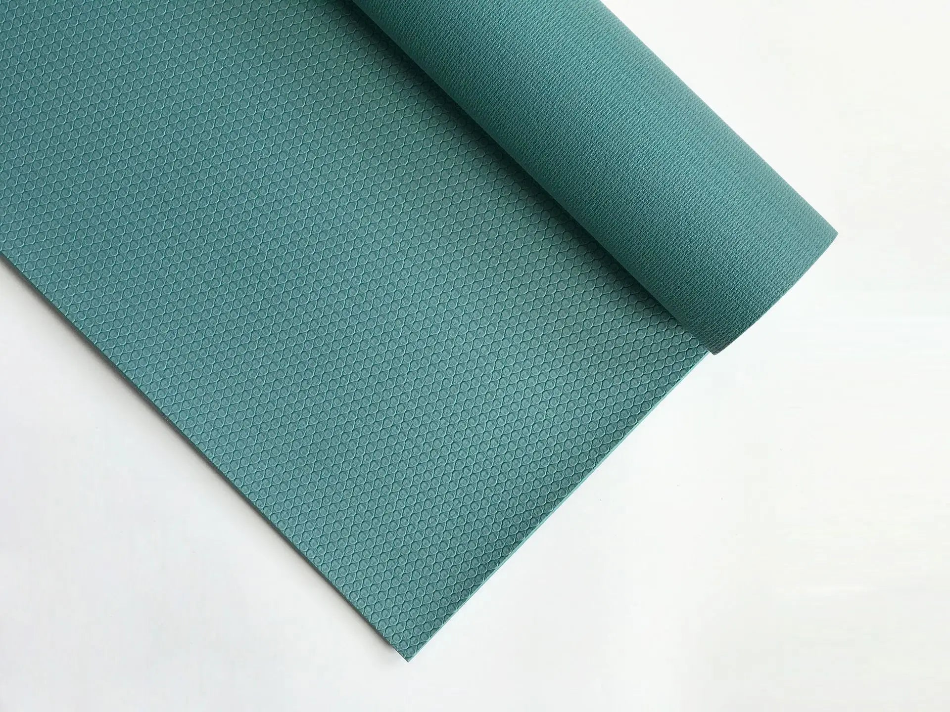 tapis de yoga sarcelle roule